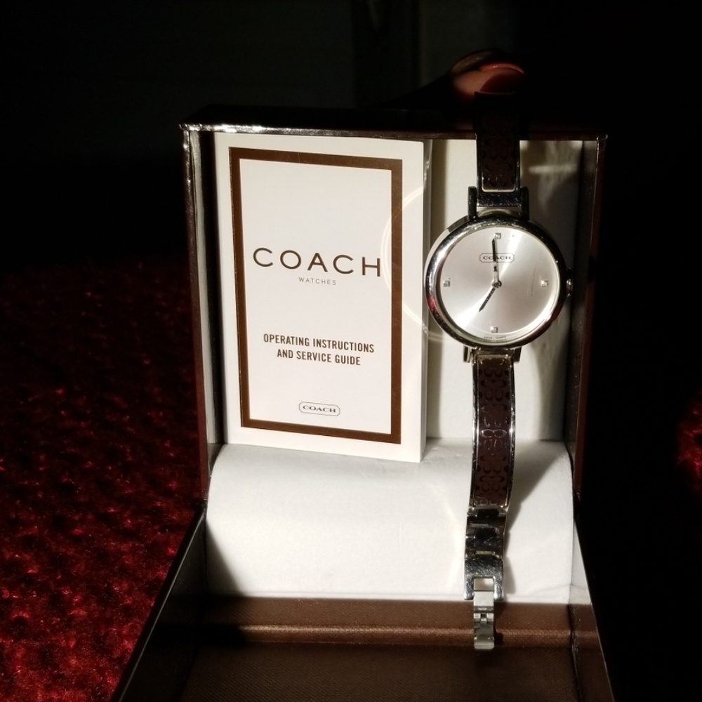 Coach ladies watch 4 diamonds.